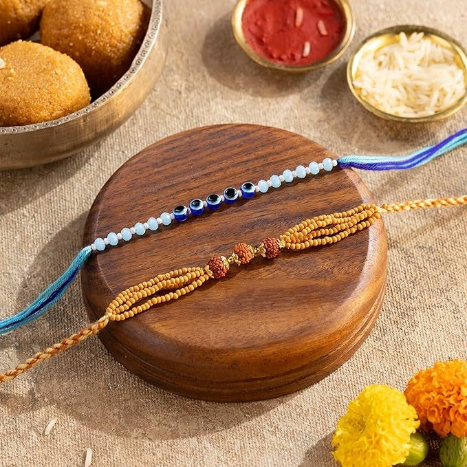 Phool Bandhan Rakhi Gift Box for Brother & Bhabhi | 9-in-1 Rakhi Hamper with Rudraksha & Ocean Gaze Rakhi, Dry Fruits, Millet Snacks, Mouth Freshener & Greeting Card